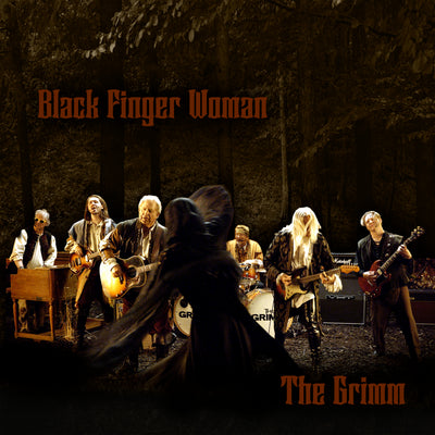 Band performing on stage with a dark, forest-themed background and text 'Black Finger Woman' and 'The Grimm'.